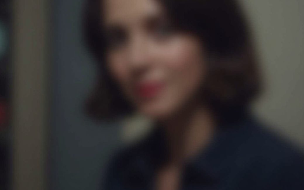 Blurry indoor photograph with soft subject and background caused by slow shutter speed